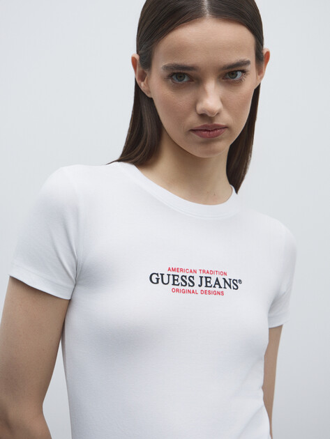 Женская футболка GUESS JEANS GJ SS CN SLIM AMERICAN TR TEE, Артикул W4YI03J1314, белый | 4803699. Ракурс 3 Женская футболка GUESS JEANS GJ SS CN SLIM AMERICAN TR TEE, Артикул W4YI03J1314, белый | 4803699. Ракурс 3