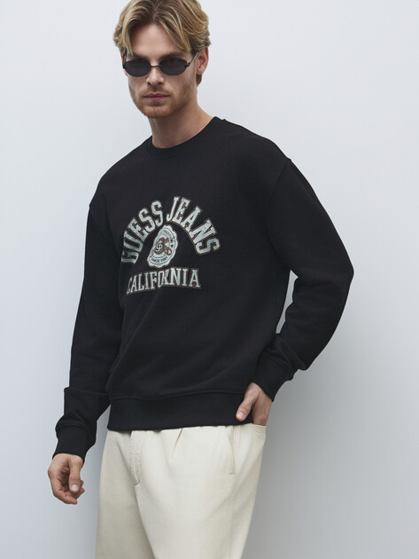Мужской свитшот GUESS JEANS GJ CN REG LS PRINTED SWEAT, Артикул M5RQ40KCPR1, черный | 4802920. Ракурс 1